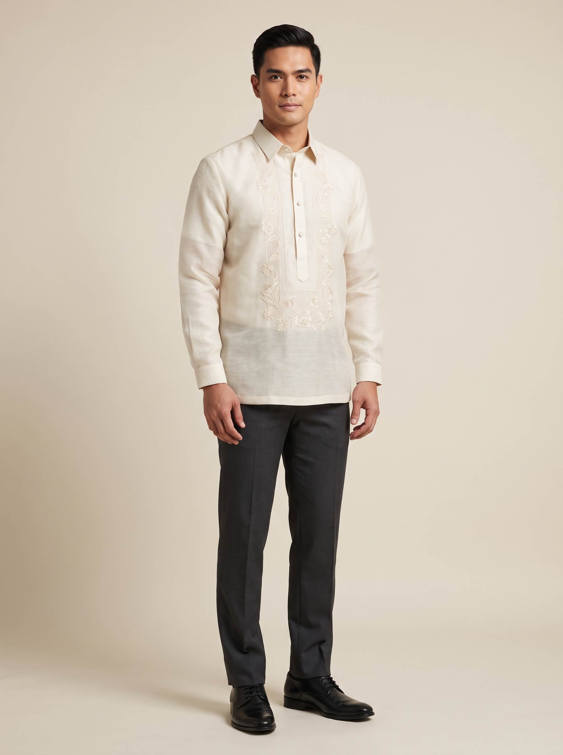 Photo reference of an ecru barong tagalog worn with dark slacks
